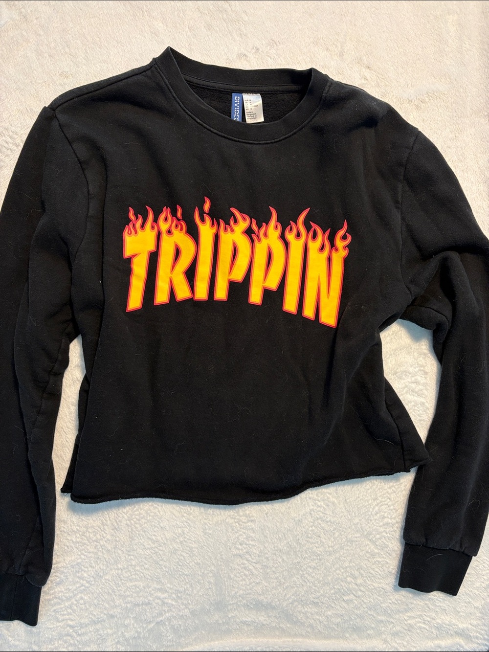 H&M Black Sweatshirt with Red and Yellow 'TRIPPIN' Flame Graphic